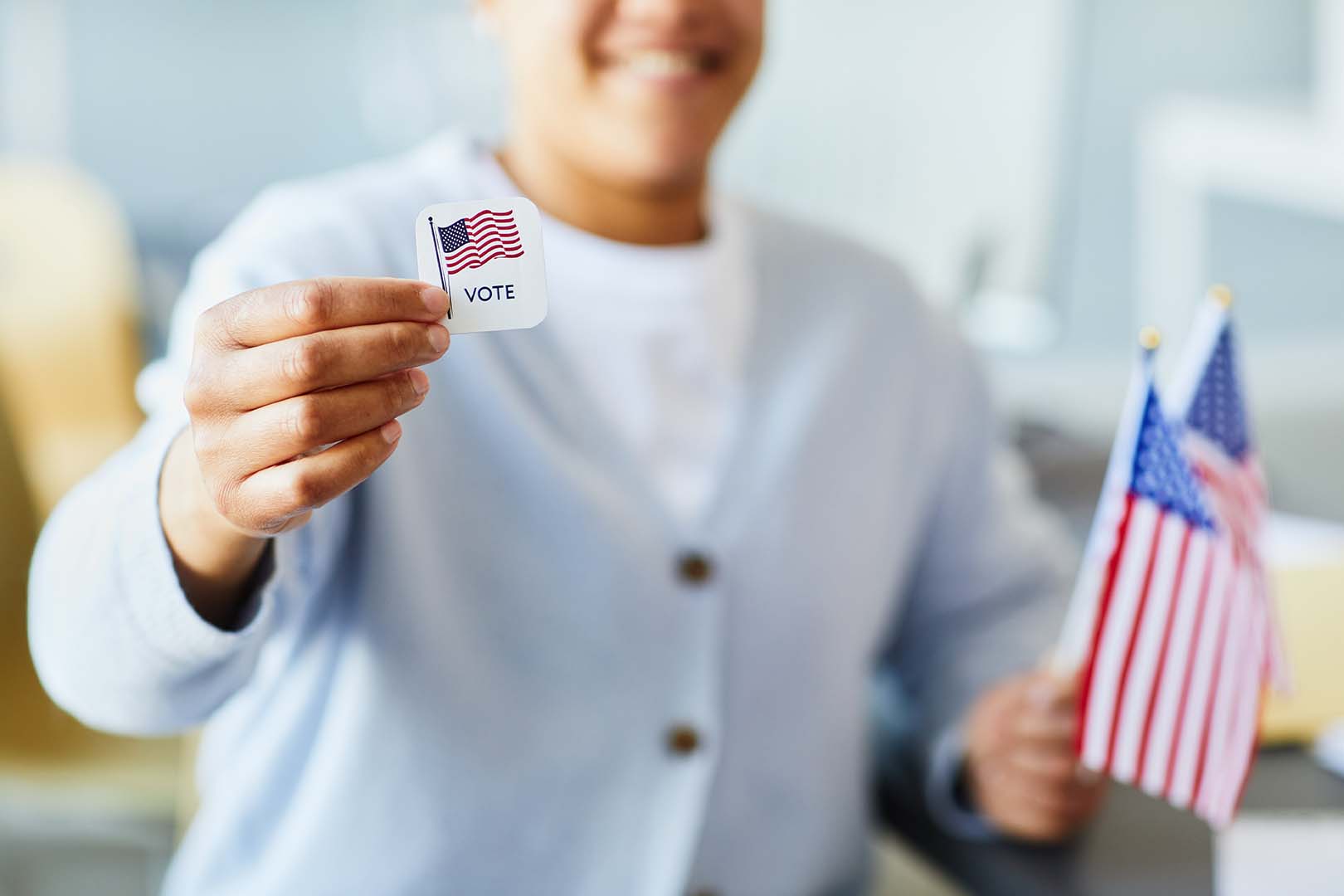 Person filling out a voter registration form